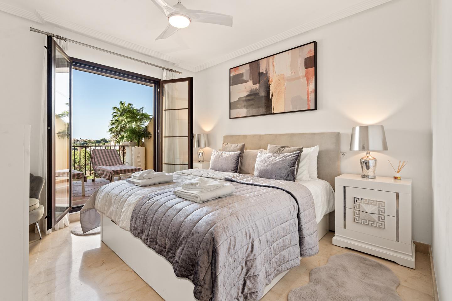 Bedroom opening onto the terrace, Los Arqueros Golf Apartment