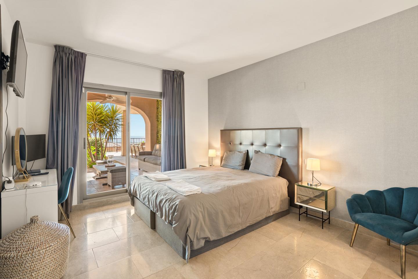 Bedroom opening onto the terrace, Benahavís Sea View Apartment