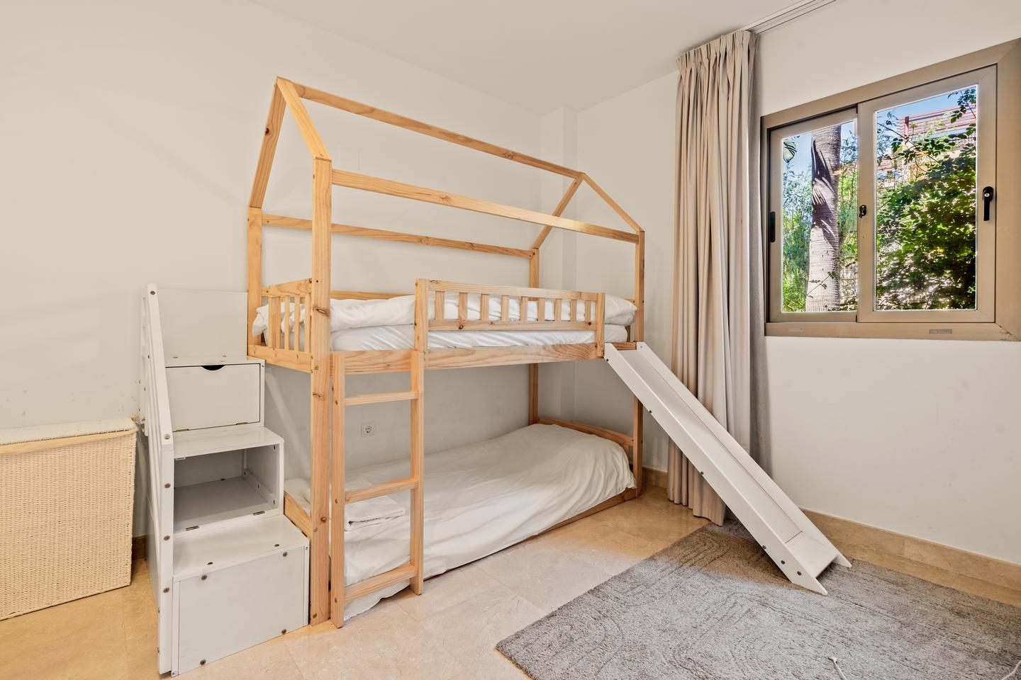 Children's room with a bunk bed, Benahavís Sea View Apartment