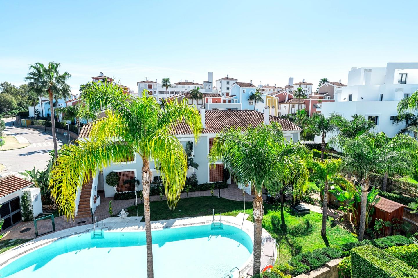 Gardens and pool, Cortijo del Mar Apartment