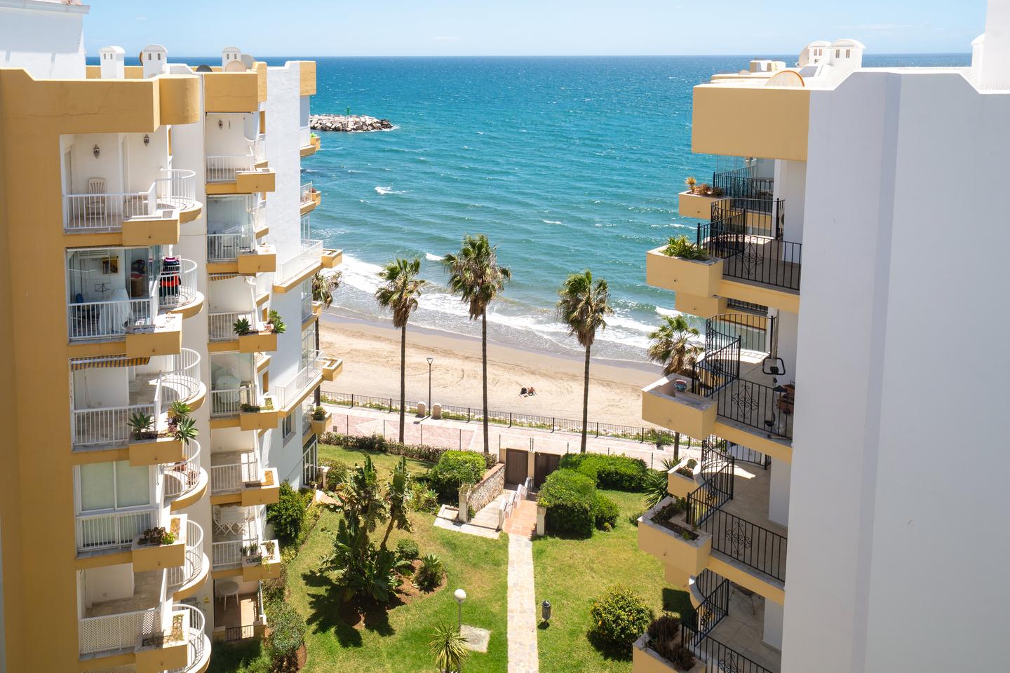 View over the gardens to the beach, Beachfront Marbella Apartment